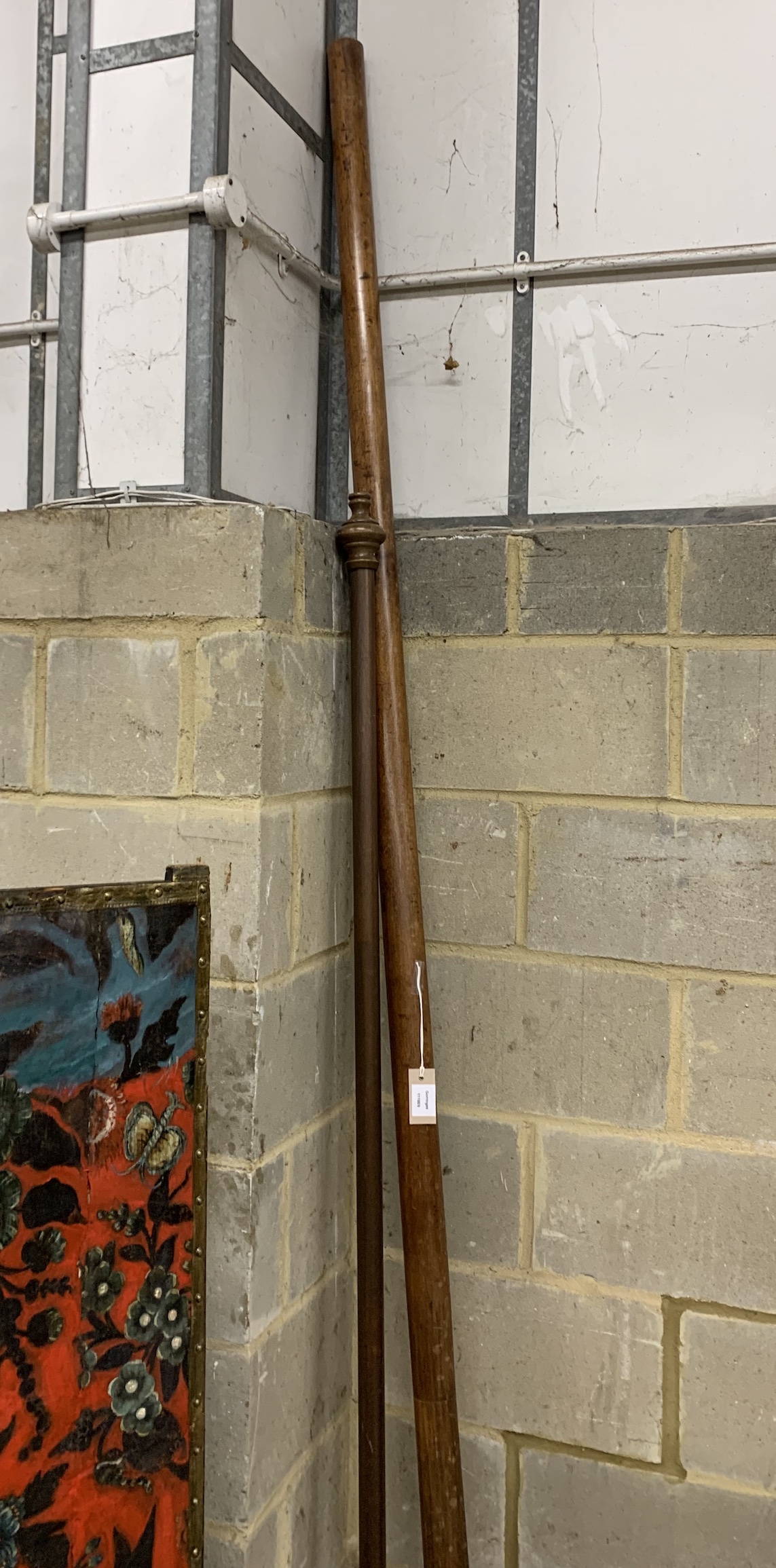 A Victorian mahogany curtain pole and rings, length approx. 300cm together with a smaller later curtain pole with rings